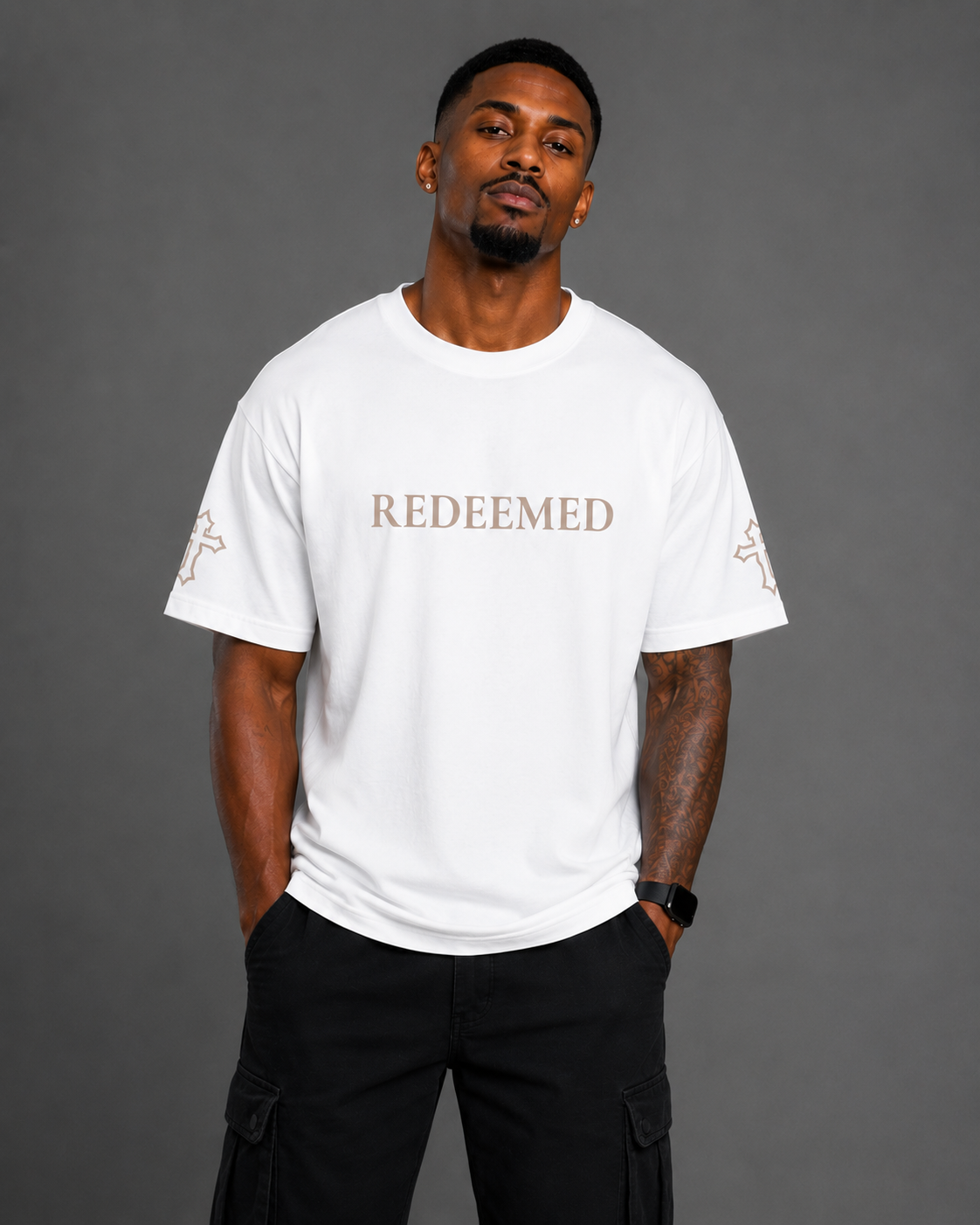 Front view of white Redeemed T-shirt from the Soul Kreations Luxe Promise Collection featuring embroidered Redeemed lettering and cross sleeve details.