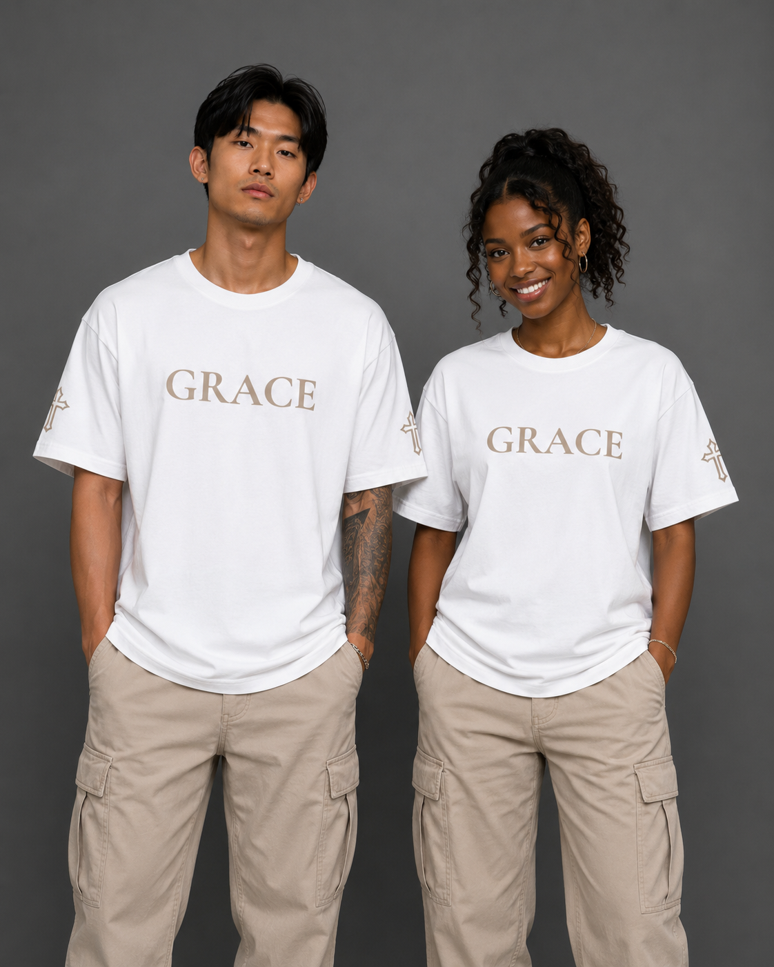 Two models wearing white Grace T-shirts from the Soul Kreations Luxe Promise Collection featuring embroidered Grace lettering and cross sleeve details. ✨