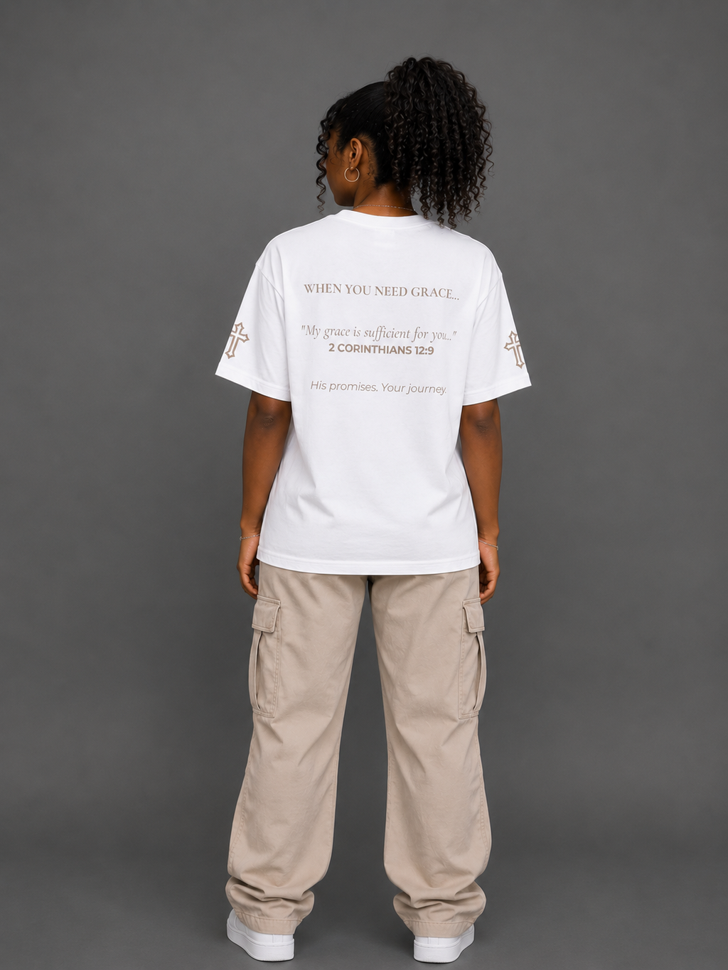 Back view of white Grace T-shirt from the Soul Kreations Luxe Promise Collection featuring 2 Corinthians 12:9 scripture and embroidered cross sleeve details. ✨