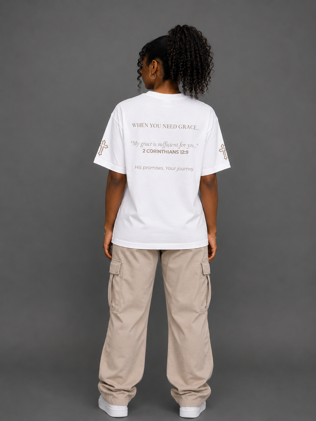 Back view of white Grace T-shirt from the Soul Kreations Luxe Promise Collection featuring 2 Corinthians 12:9 scripture and embroidered cross sleeve details. ✨