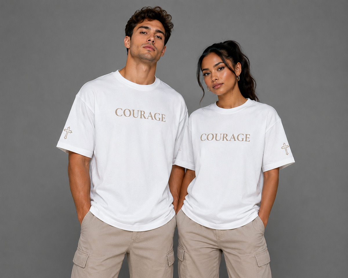 Male and female models wearing white Courage T-shirts with embroidered Courage lettering and cross sleeve details from the Soul Kreations Luxe Promise Collection. ✨