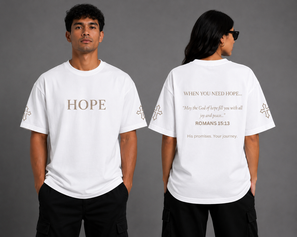Male and female models wearing white Hope T-shirts from the Soul Kreations Luxe Promise Collection, showing embroidered HOPE chest and cross sleeve details with Romans 15:13 scripture printed on the back.
