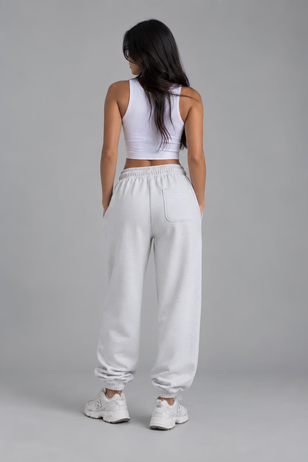 Back view of light heather gray embroidered sweatpants with relaxed fit and back pocket 