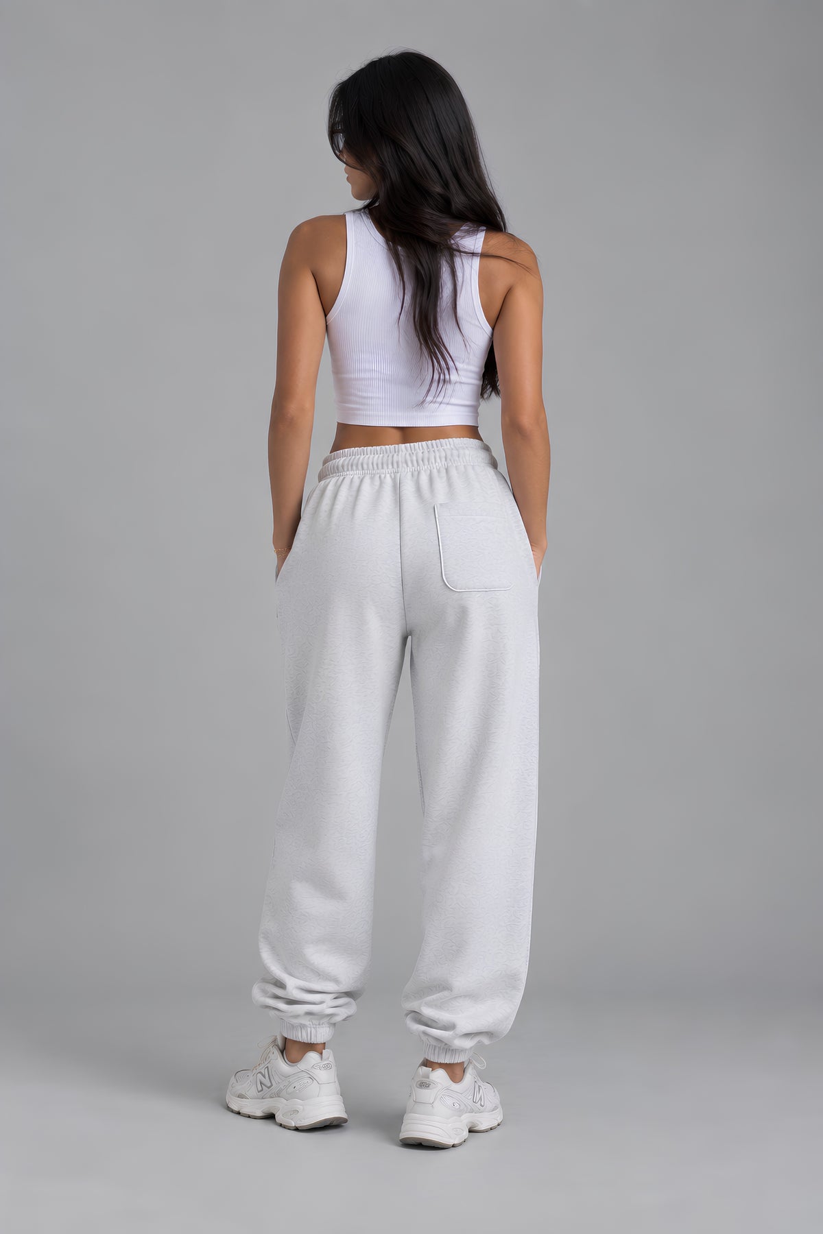 Back view of light heather gray embroidered sweatpants with relaxed fit and back pocket 